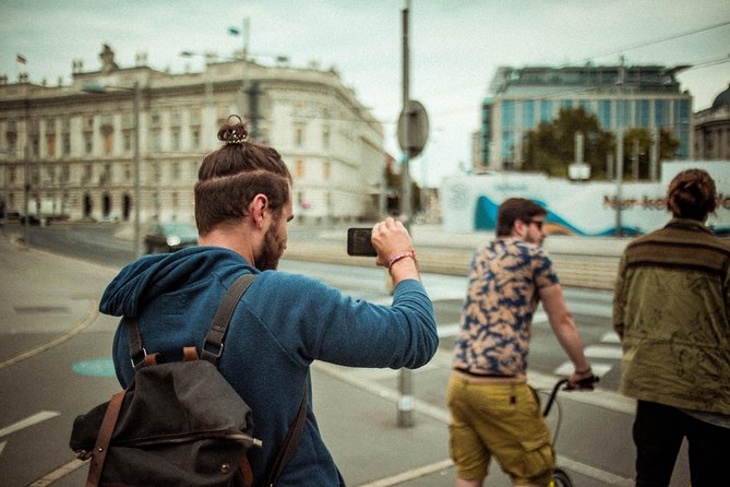 Kick-Bike Small-Group Tour Through Vienna with Locals - Taking a food break at Naschmarkt