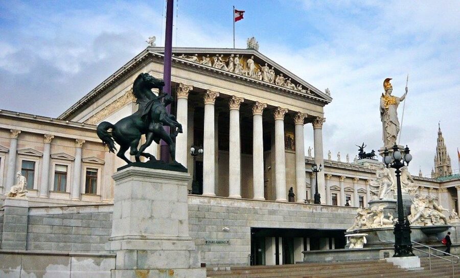 Vienna: Walking Tour of the Historic Ringstrasse - Volksgarten, flower beds, and statues